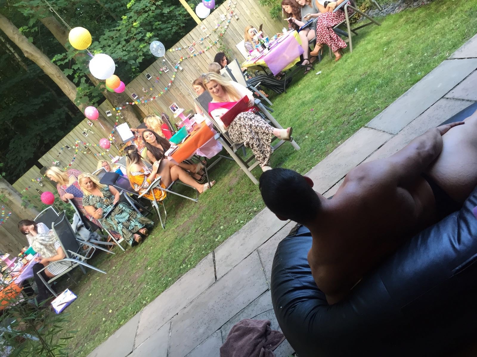 Outdoor hen party life drawing session with model lying down